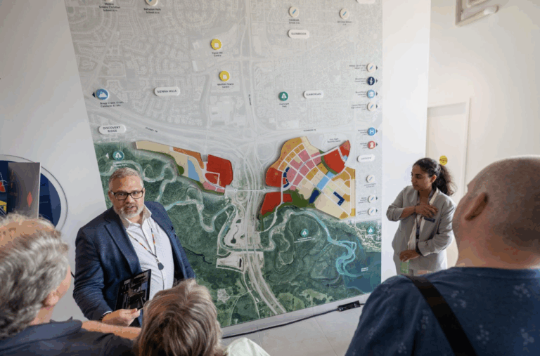 Travis Oberg sharing the vision for Taza Park with visitors at the Sales & Marketing Centre.